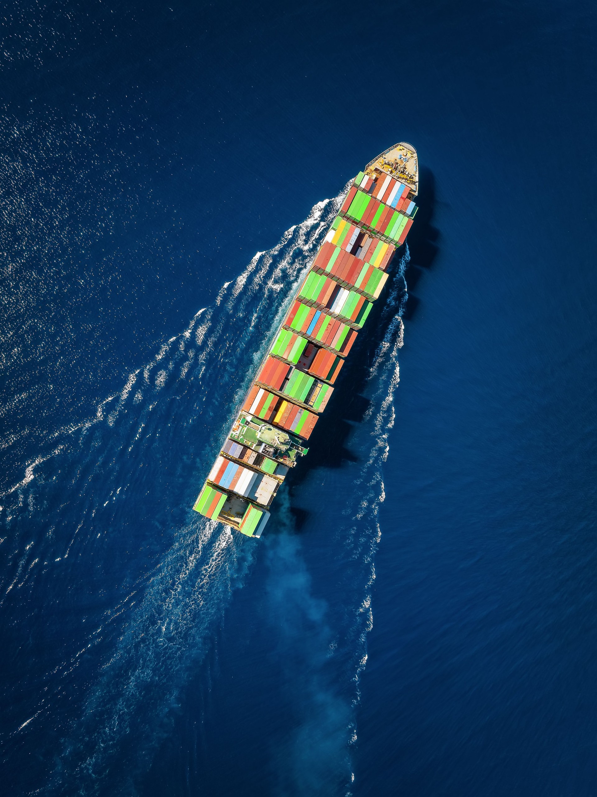 High aerial overhead view of a large industrial container cargo ship