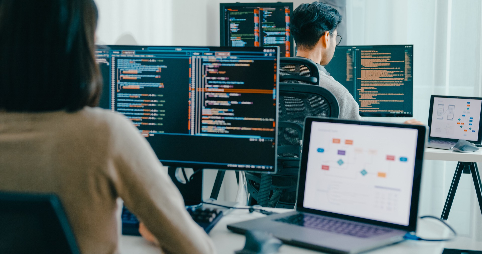 Group Asia male, female freelance typing write prompt AI bot IT app smart program nomad, video game, terminal with coding language, user interface, designer, big data center on desktop computer.